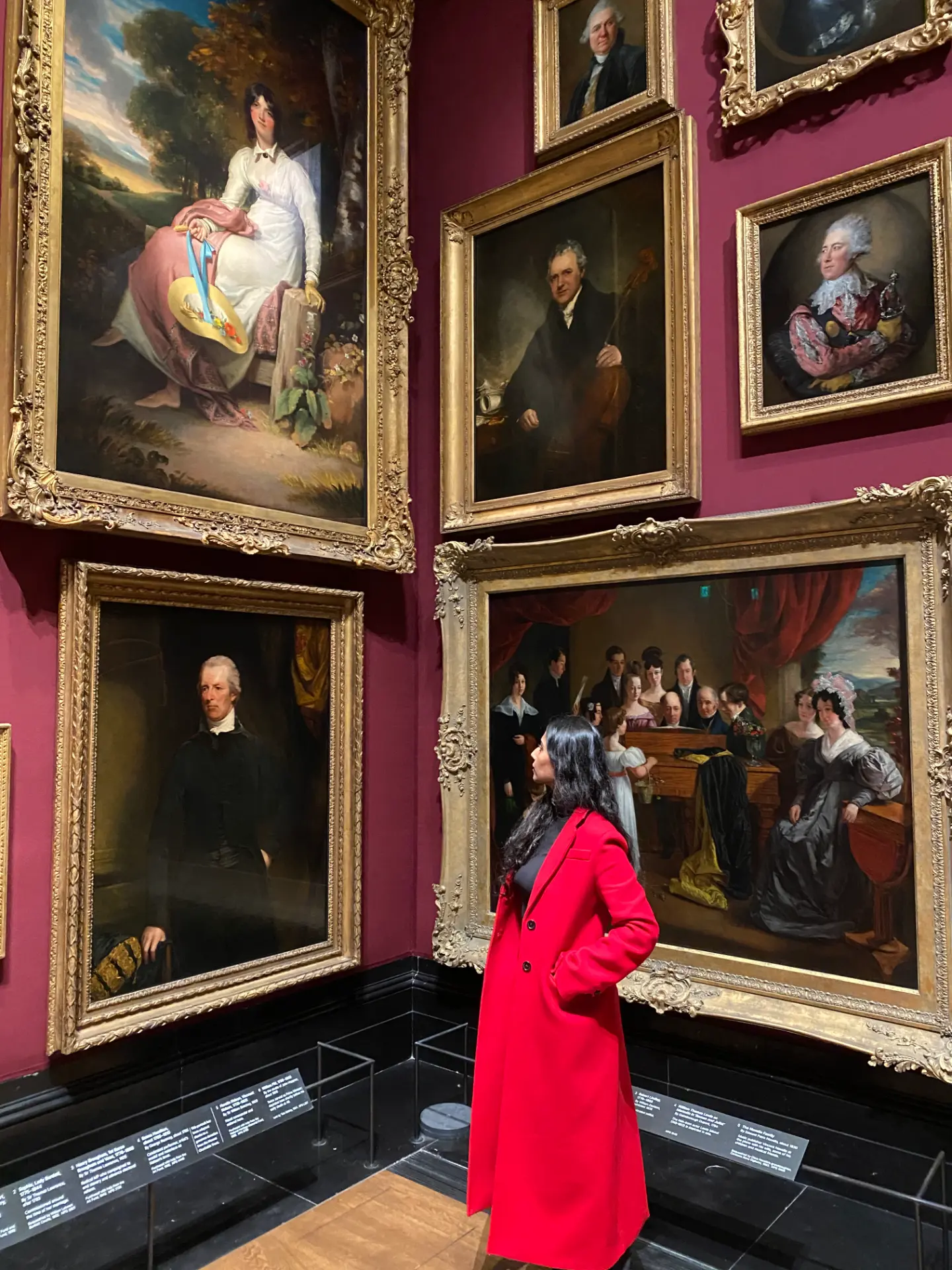 The artist viewing classical portraits in a European gallery