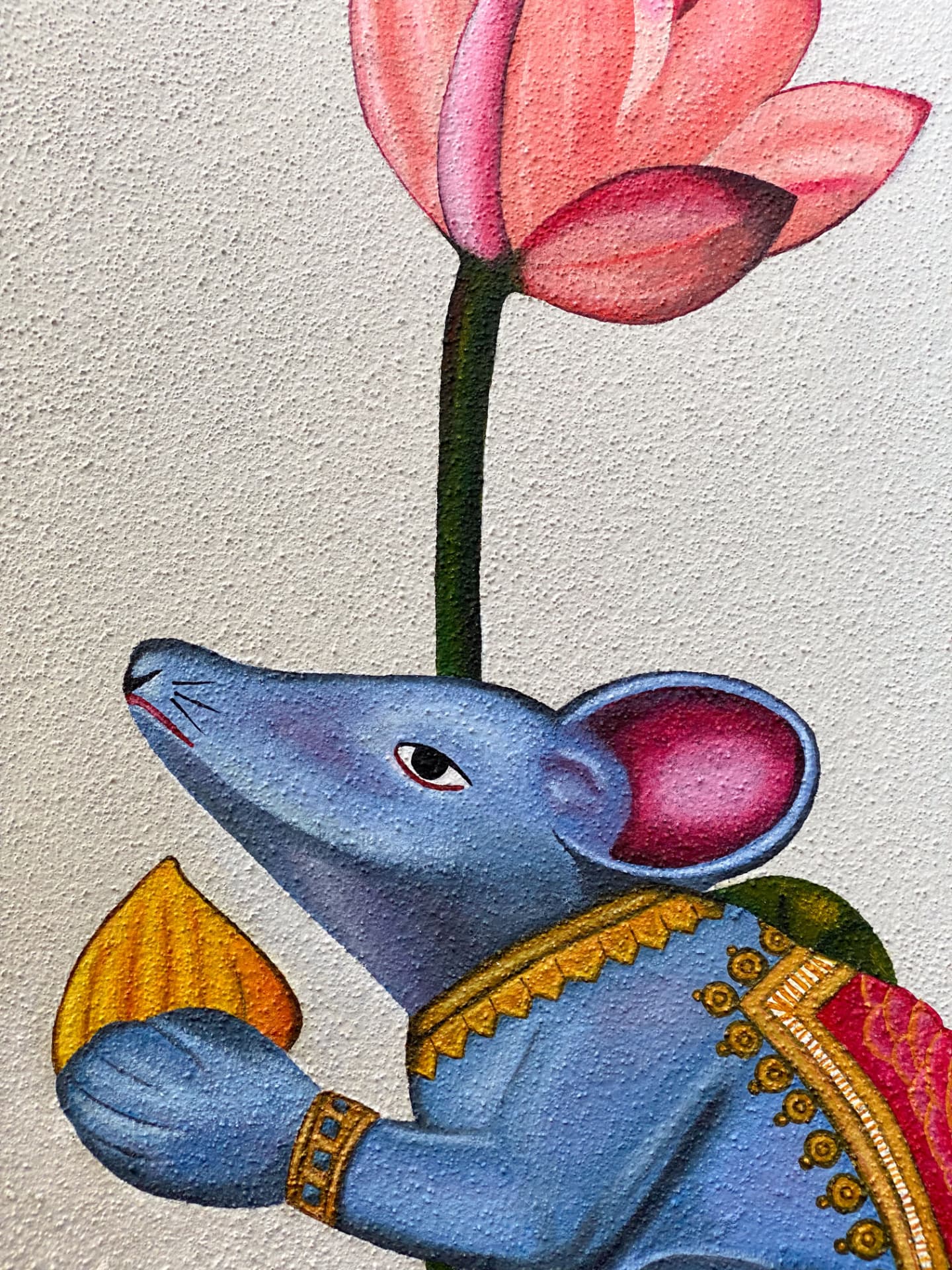 Hand-painted blue mouse in golden ornaments beneath a pink lotus