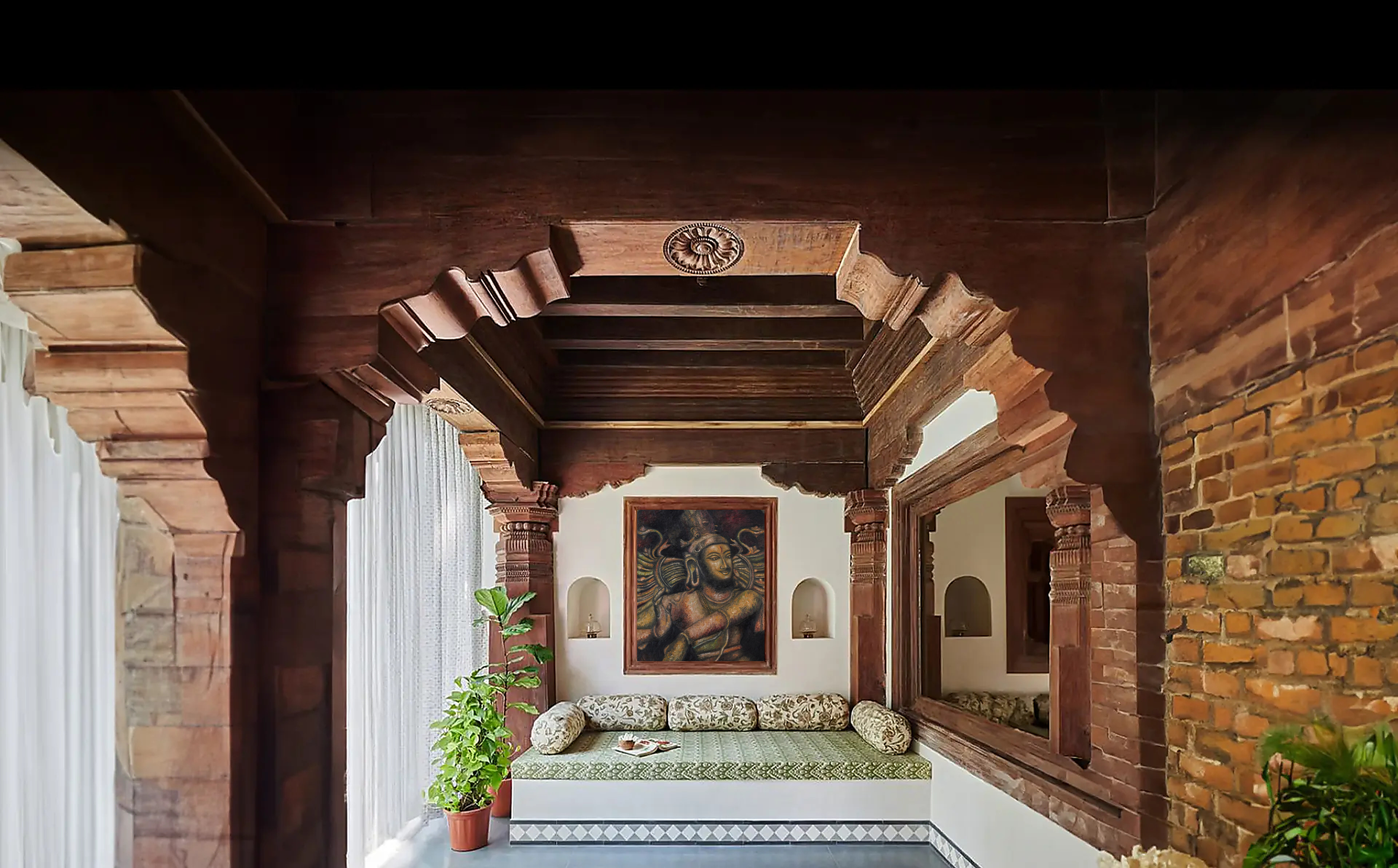 A painting by Shantrika hanging in a heritage teak-and-brick veranda